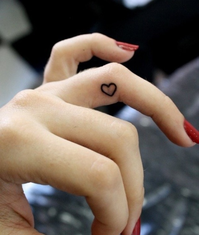A small heart shaped tattoo on the side of your ring finger is a pretty and romantic idea to rock