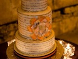 a vintage-inspired wedding cake with love letter tiers, gold beads, a neutral and orange bloom is a beautiful and chic idea for a vintage wedding