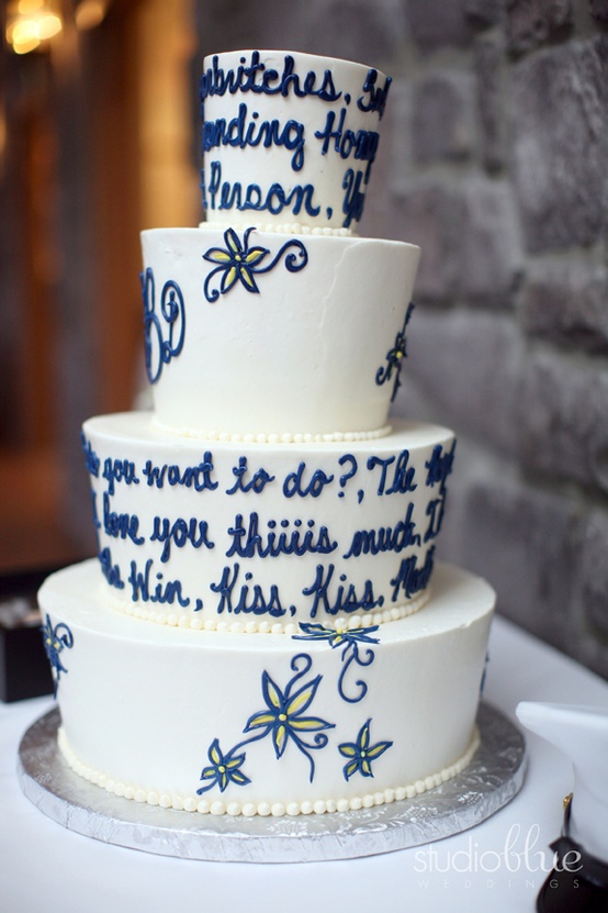 a white wedding cake with black love letters on the tiers is a classic idea for a black and white wedding with a vintage feel