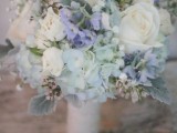 a delicate wedding bouquet of white, pale blue and purple blooms plus pale foliage is a beautiful idea for a vintage-inspired bride