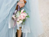a modern pale blue wedding ballgown with a layered skirt and a draped bodice is a gorgeous and out of the box idea for a wedding