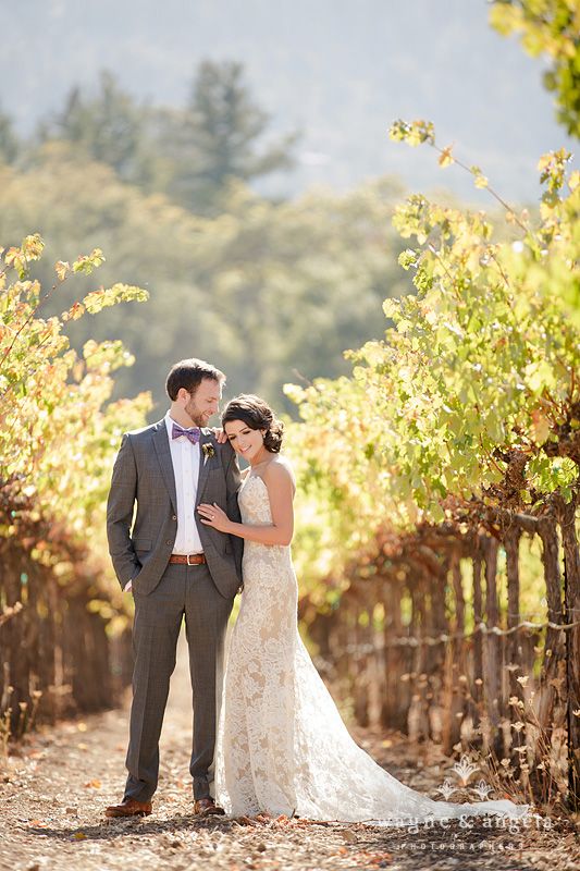 A strapless lace sheath wedding dress with a train is a chic and romantic idea to pull off at a vineyard wedding