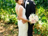 a sheath wedding dress with thick straps, a cutout back and lots of floral appliques all over the dress