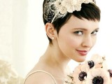 a long pixie haircut styled for the wedding with a headband with lace flowers and a tiny veil is a stylish and chic idea for a modern bride