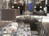 a silver wedding table and chairs plus white porcelain and white floral centerpieces for a frozen winter wedding