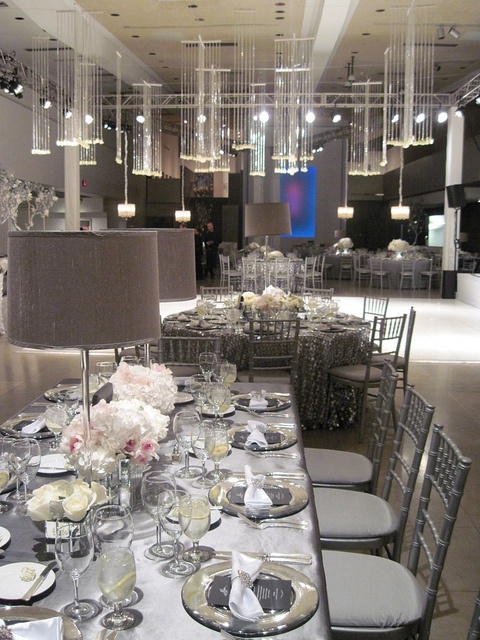 A silver wedding table and chairs plus white porcelain and white floral centerpieces for a frozen winter wedding