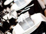 silver favor boxes, chargers and cutlery for adding a frozen touch to your wedding reception space