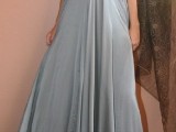 a silver maxi bridesmaid dress with a depe neckline and an embellished neckline for a sexy look