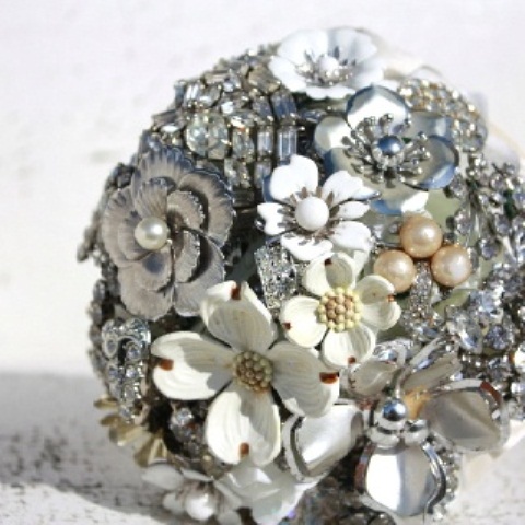 A silver and white brooch wedding bouquet with beads and rhinestones is a glam and bright idea for a winter bride