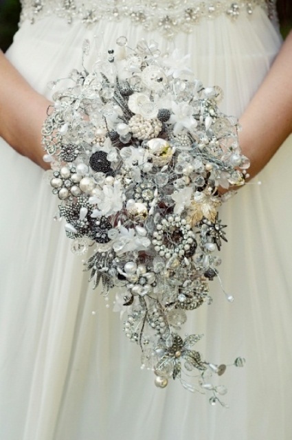A sparkling cascading silver brooch wedding bouquet is a unique and bold idea for a winter bride, and such a bouquet will last long