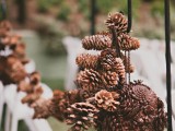 a pinecone ball and a pinecone garland will accent your wedding aisle in the best way