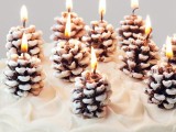 snowy pinecone candles will accent your winter wedding space in a lovely and cool way