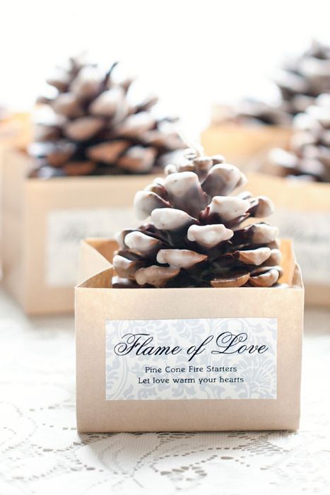 pinecone fire starters in mini boxes are cool wedding favors for a fall or winter wedding