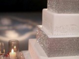 a super glam square wedding cake with white patterned and silver glitter tiers is very chic and very fun