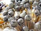 white and brown swirl chocolate cake pops with edible beads will complete your wedding dessert table