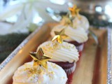 red velvet cupcakes with frosting, gold glitter and gold stars are very chic and very fun