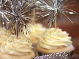 cupcakes in metallic liners and with shiny and fun toppers for a NYE wedding