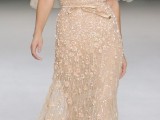 a peachy embellished sheath wedding dress with floral appliques, wide sleeves and a deep V-neckline