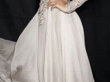 a dove grey wedding dress with an embellished bodice, long sleeves, a high neckline and a plain skirt is very refined and chic
