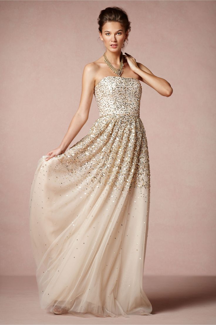 A strapless blush A line wedding dress with gold sparkles is a chic and beautiful idea with a romantic twist