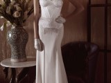 a sexy and elegant strapless sheath wedding dress with a corset top, lace, a statement necklace and gloves
