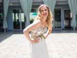a beautiful modern strapless wedding dress with a gold sequin bodice and a contrasting white skirt is very chic and glam