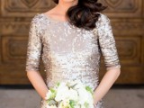 a silver sequin bridesmaid dress with a high neckline and short sleeves plus a white bouquet are a lovely idea for a winter wedding
