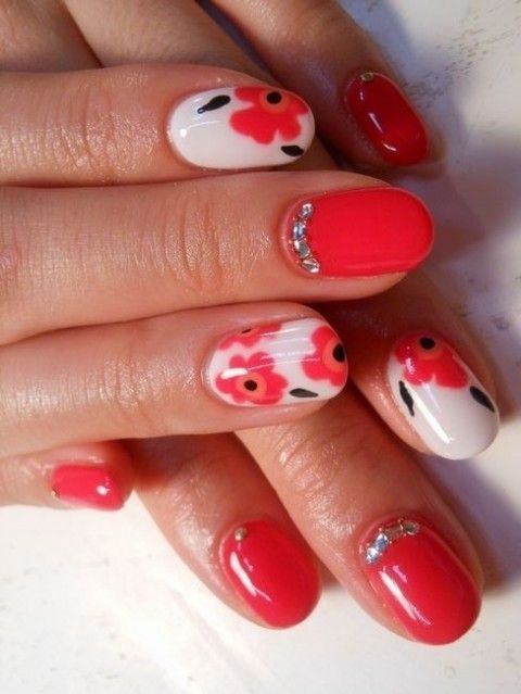 bright coral nails and white nails with bold coral floral patterns and rhinestones are amazing for a bold spring wedding