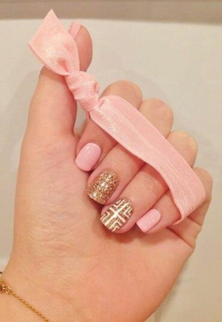 pink nails with gold glitter and white patterned nails for a bolder accent is a bright and cool idea