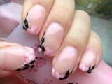 whimsical pink nails with pink and black floral patterns only on the tips are an interesting solution for spring or summer