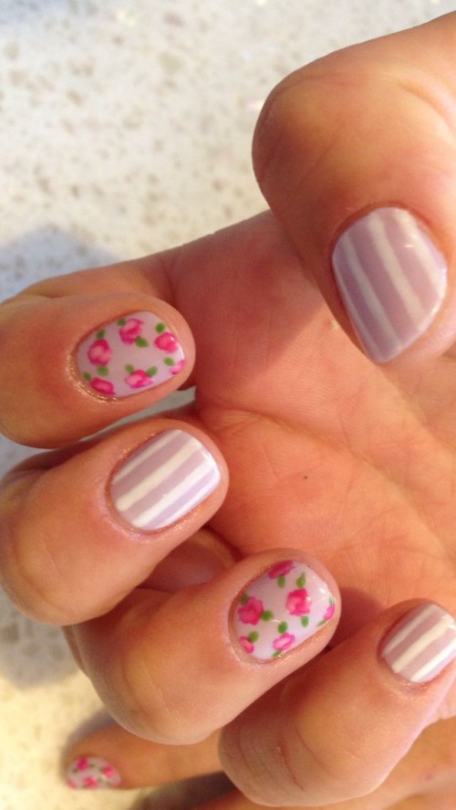 lilac and white striped nails and bright floral pattern ones are amazing for a whimsy spring or summer look