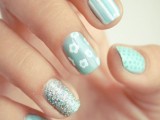 aqua colored nails with various patterns and an aqua glitter accent nail for a bright and fresh spring wedding
