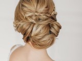 a tight wavy and twisted low chignon with lots of swirls on long hair is a unique way to show off your locks and their length, it doesn’t require any additional detailing