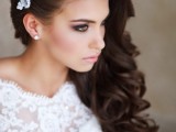 fab long waves down on one side accented with a lace and rhinestone hairpiece on the other side is a gorgeous idea to rock