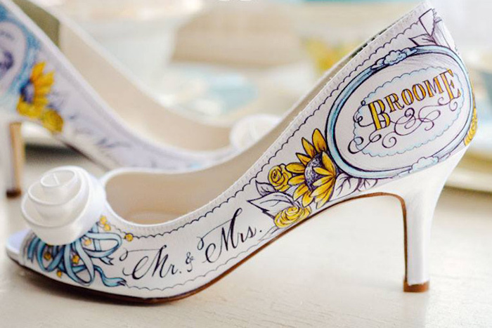 a white shoe with colorful graffiti is a cool idea for a modern bride who wants to stand out from the crowd and look wow