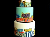 a bold graffiti wedding cake with all the tiers with creative graffiti decor and silver leaf is amazing for a bold big city wedding