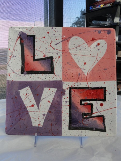 a LOVE graffiti sign in bold colors is a cool decor idea for your wedding, and you can make it yourself