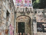 an old building with colorful graffiti is a lovely location to tie the knot and to take wedding portraits there