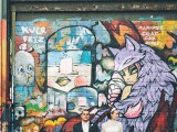 a bright graffiti wall is a lovely backdrop for fun wedding portraits, it will add color and interest to them