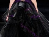a breathtaking black and purple sleeveless wedding ballgown with a sheer bodice and lace appliques plus a layered ruffle skirt