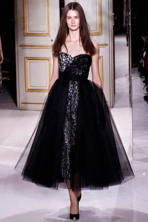 a strapless black midi ballgown with lace and tulle cover and a belt for a catchy and one of a kind look