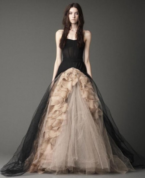 a strapless black and tan wedding ballgown with a sleek bodice and a skirt with tiers of tan tulle
