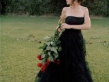 a strapless black A-line wedding dress with a tiered full skirt is a very refined and very romantic option to try