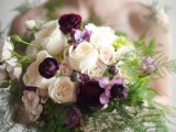 a bright wedding bouquet with purple and white blooms, with ferns is a beautiful option for a dramatic woodland bride