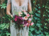 a chic pink and purple wedding bouquet with greenery will fit many colorful weddings including a woodland one