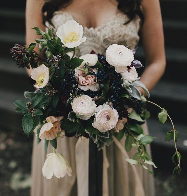 A catchy woodland wedding bouquet of white and blush blooms, lots of privet berries and foliage is a lovely idea for a garden or forest bride