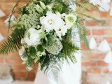 a beautiful wedding bouquet of white blooms and various kinds of greenery and ferns is great for a spring or summer bride