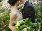 a green woodland wedding bouquet with much greenery and ferns, with berries and lotus and some green hydrangeas is a lovely idea