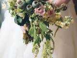 a cascading wedding bouquet of greenery, white and pink blooms, dried blooms and succulents is a catchy idea