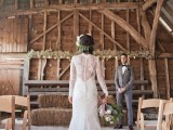a romantic lace fitting wedding dress with long sleeves, an illusion back and a train